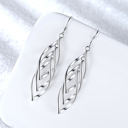 Solenne Aretes Onda Tejida | Oro Blanco